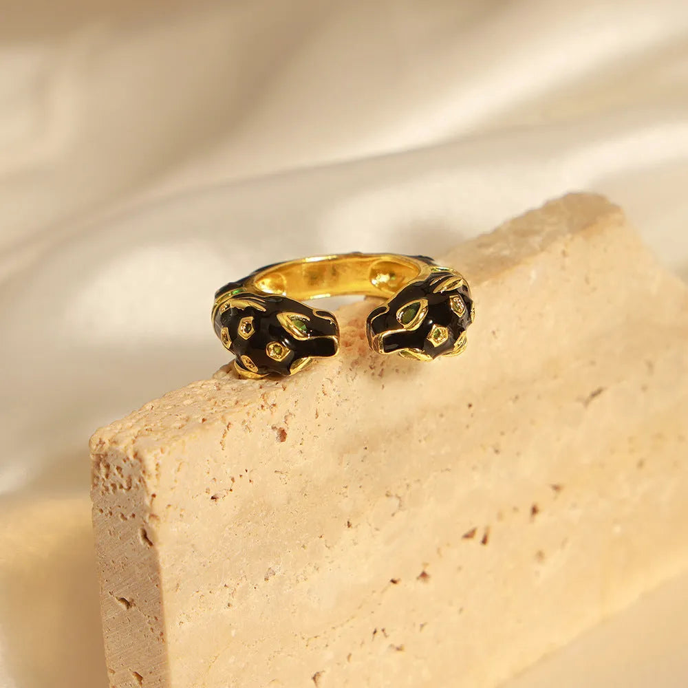 Geometric open ring with black cheetah pattern, copper construction, UK size 7 women's jewellery