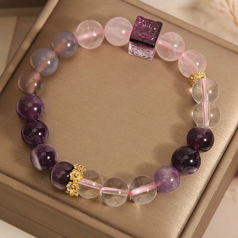 Women's purple amethyst crystal bracelet with rhinestone accents showing 10mm stones