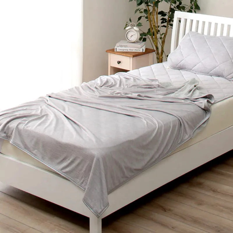 Blue cooling blanket with Japanese Q-Max 0.4 heat-absorbing fibres measuring 180cm wide