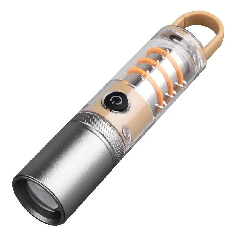 Orange or beige flashlight with dual light source, hook, and keychain, measuring 15cm in length