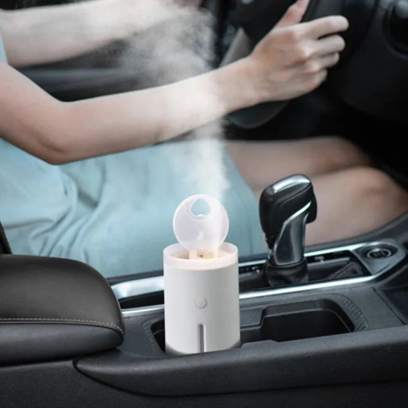 Porcelain white spitting circle humidifier with 360ml tank, USB power, and atmosphere lamp, 142*86*86mm