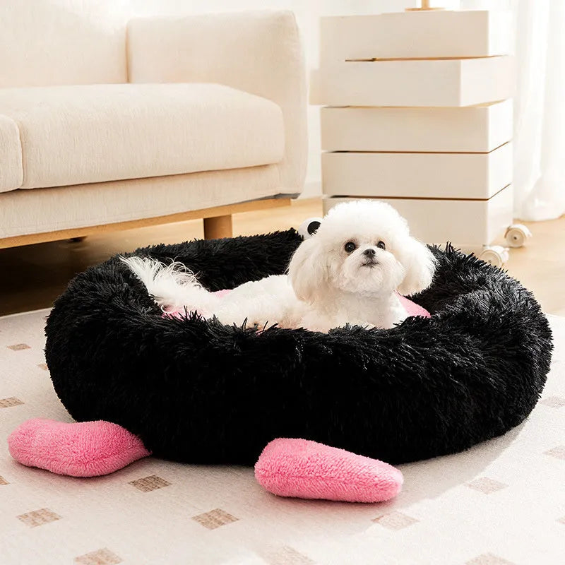 Blue plush kennel-style dog bed with raised sides, shown on a wooden floor.