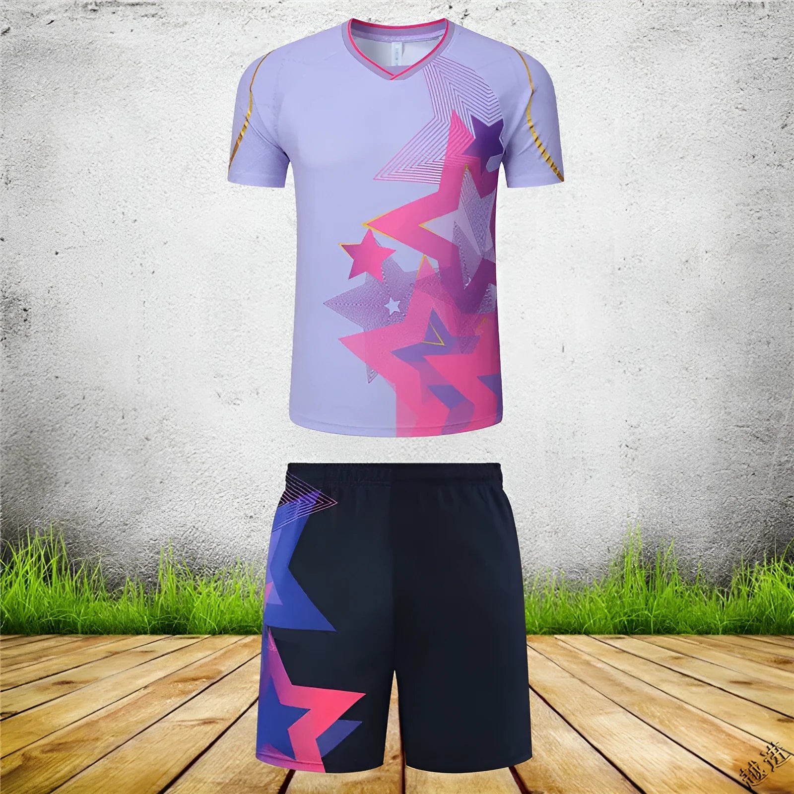 Badminton outfit set showing short-sleeved top and trousers in sapphire blue colour