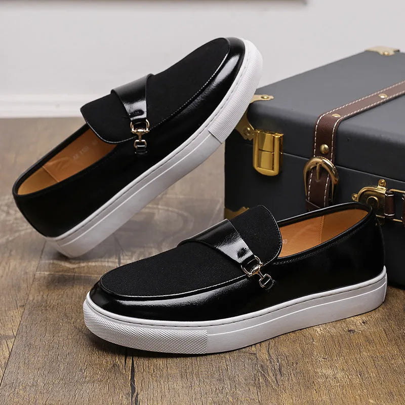 Men's black slip-on loafer with a gold horsebit buckle, round toe, and visible stitching.