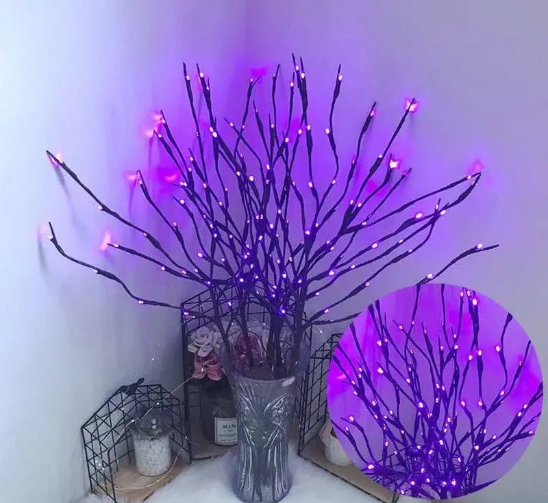 LED tree light with silver branches in vase, showing multiple colour options including warm white and blue illumination