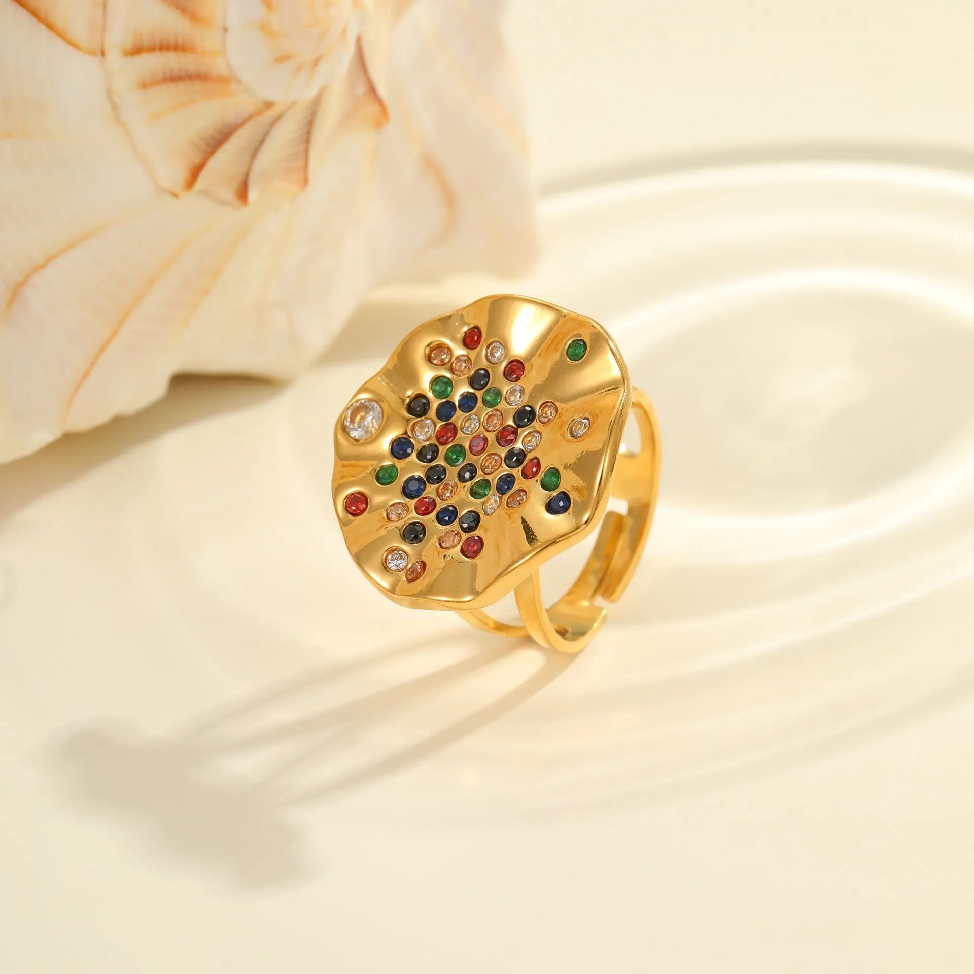 Geometric open mouth stainless steel ring with pleated setting and inlaid diamonds.