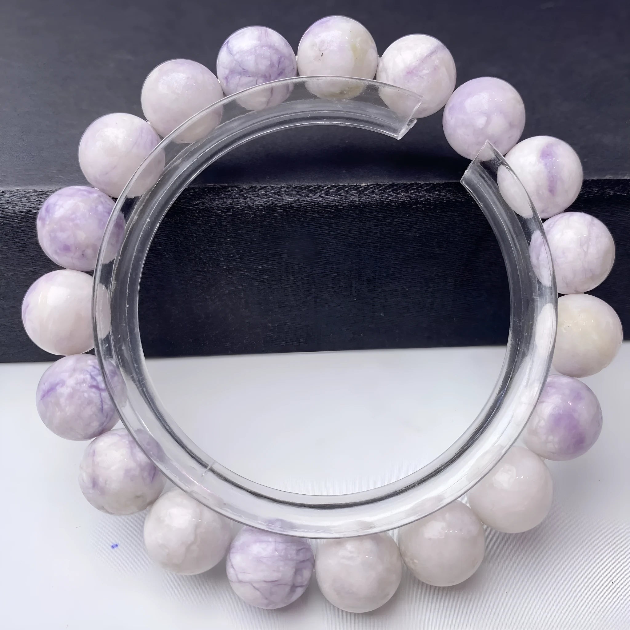 Natural purple turquoise bead bracelet for women on a white background, showing adjustable string tie.