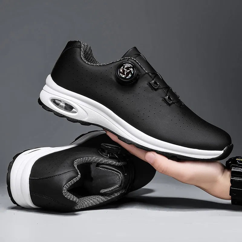 Low-top casual shoes in black with mesh upper, composite sole, and lace-up front closure on a neutral background