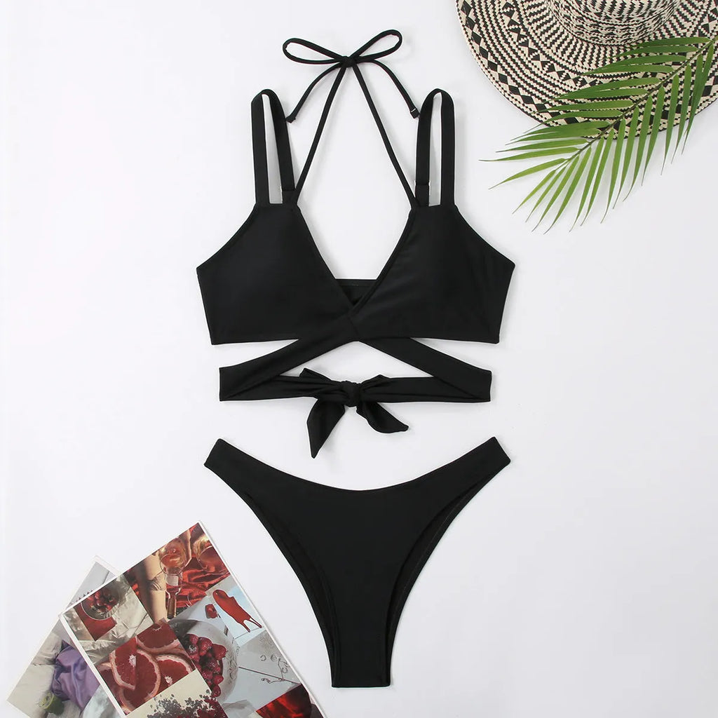 Women's solid colour bikini swimsuit with adjustable straps in briefs style, available in multiple colours