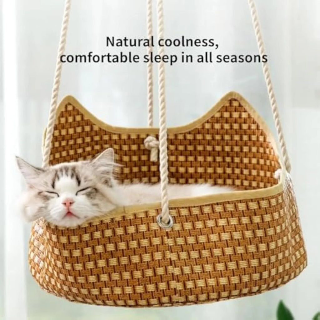 Green rattan cat hammock with metal hooks, shown hanging in a cage.