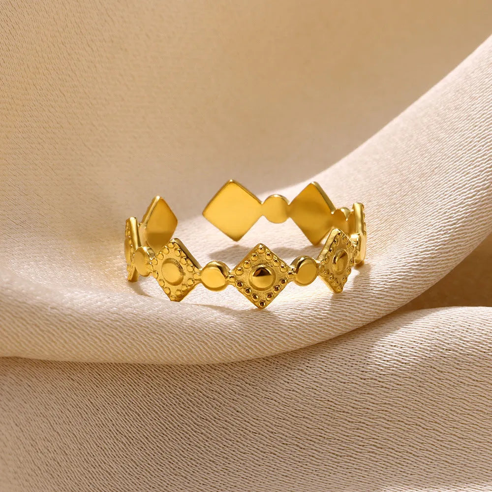 Geometric titanium steel women's ring with gold diamond finish, adjustable free-size band, and hypoallergenic properties