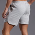 Men's below-the-knee cotton workout running capris in light gray, loose straight mid waist summer shorts