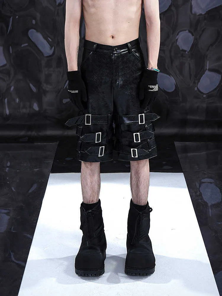 Men's black PU leather cropped shorts with medium-low waist, showing polycarbaminate fibre construction and contemporary design