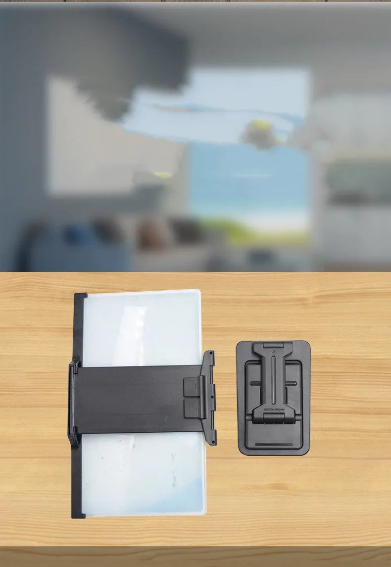 Black 12-inch mobile phone screen amplifier with detachable magnifier and phone holder in folded position