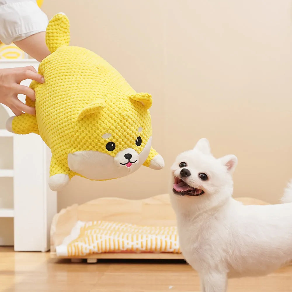 Calming plush dog toy with squeaker vocalisation feature in bite-resistant material