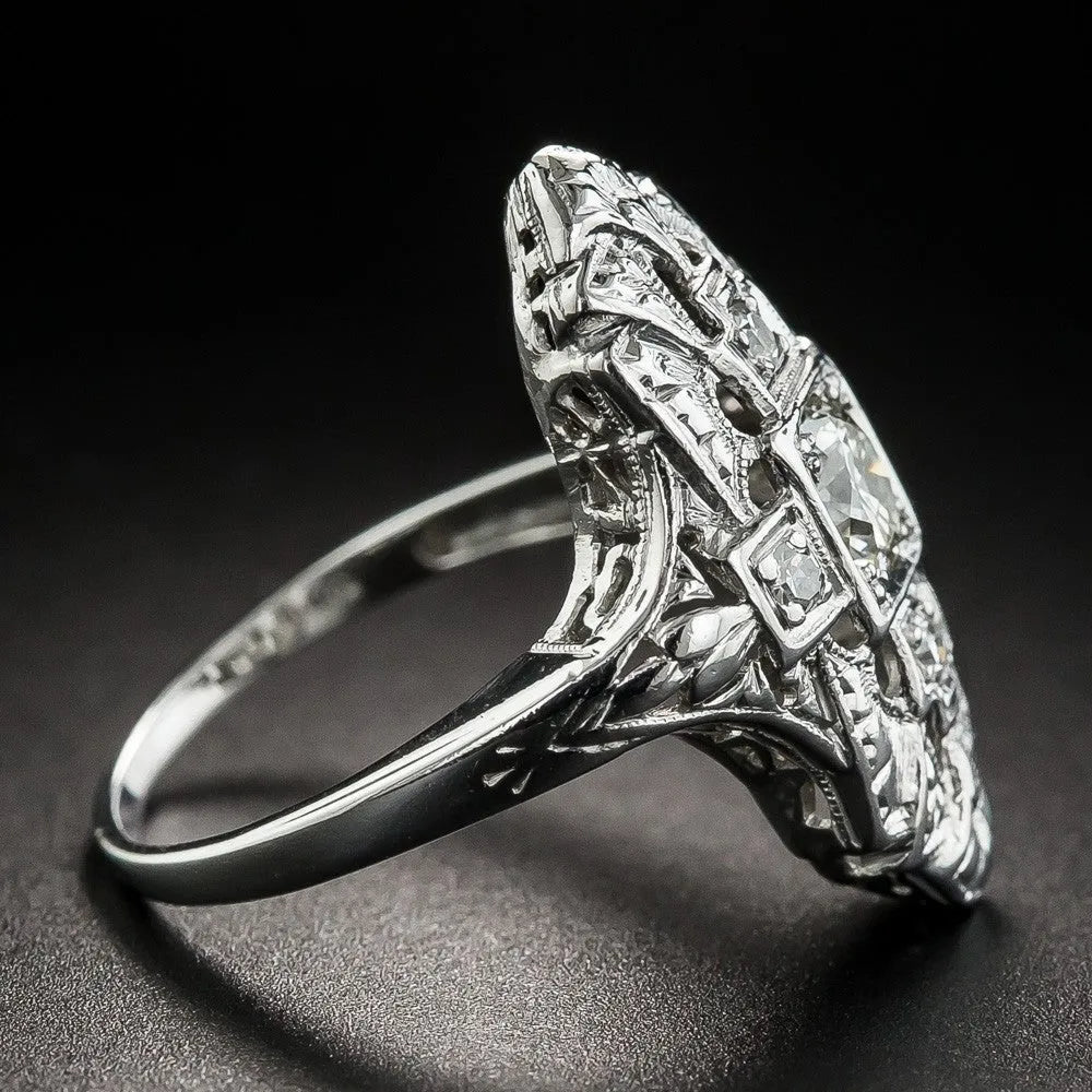 Silver electroplated hollow geometric diamond-studded ring showing negative space band design