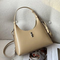 Genuine leather crossbody shoulder bag with dumpling shape, internal organisation pockets, and street trend style details