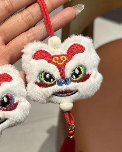 Handmade blue plush lion keychain ornament with star stone accent and embroidered cartoon features