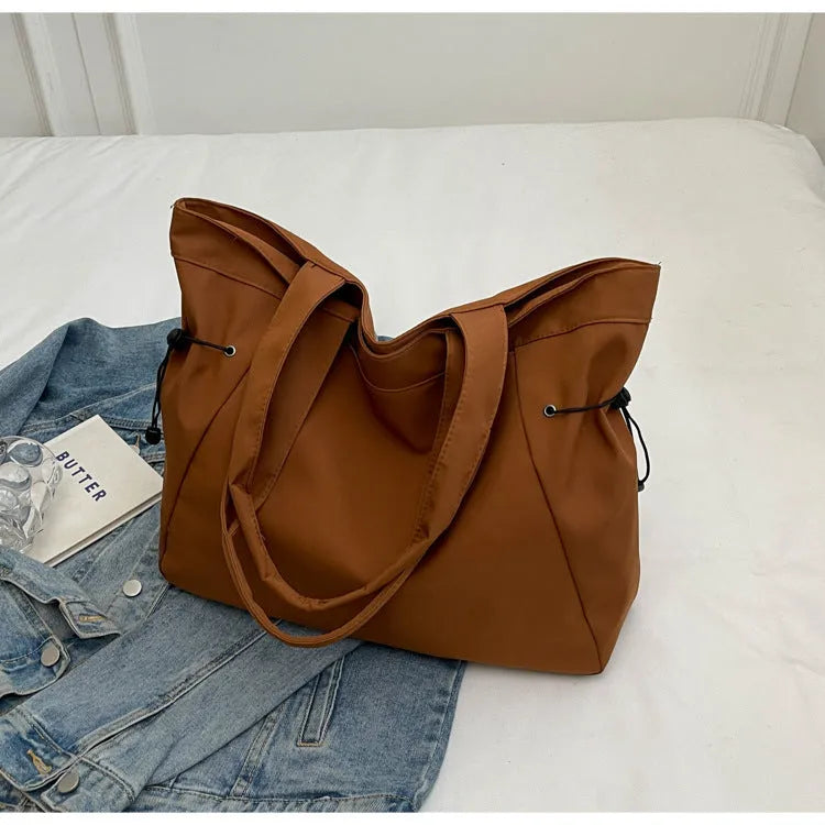 Soft foldable Oxford cloth tote bag in street style, shown in a choice of five colours.