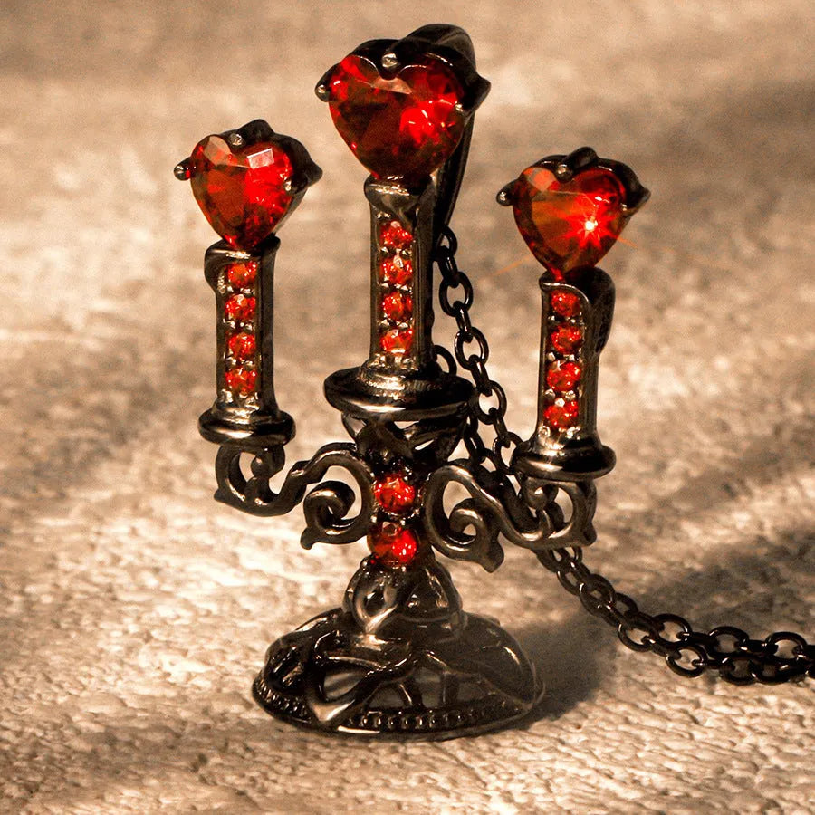A women's gothic-style necklace with a hollow candlestick pendant on a cross chain, in a retro candlestick colour.
