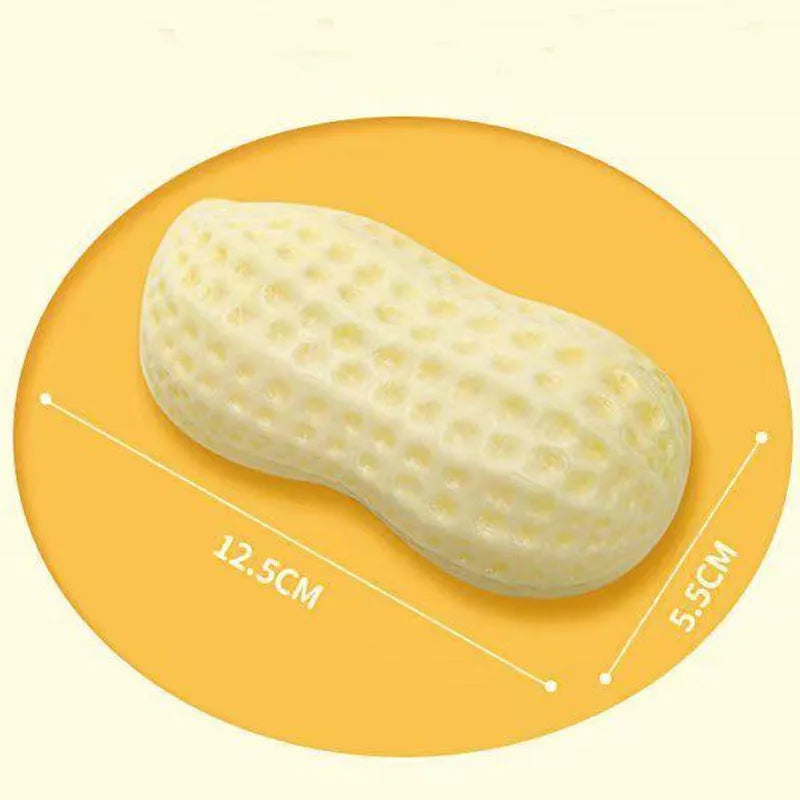 Yellow TPR peanut-shaped dog chew toy with textured surface and squeaker function