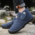 Men's snow boots in black with non-slip rubber soles and plush lining for winter use.