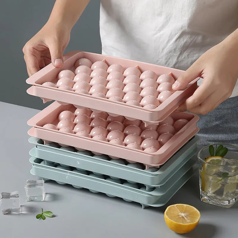 Sky blue and pink 3D round ice ball mould trays with 18 and 33 grid options for home bar use.