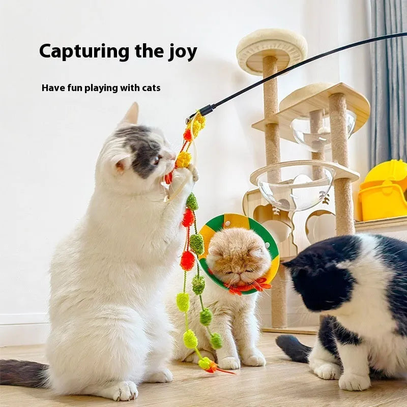 Rainbow cotton candy plush cat teaser on a long, bite-resistant stick with a bell inside.