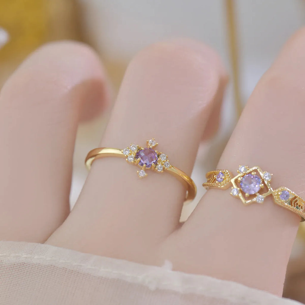 Geometric copper open mouth ring with purple zircon stones in round settings