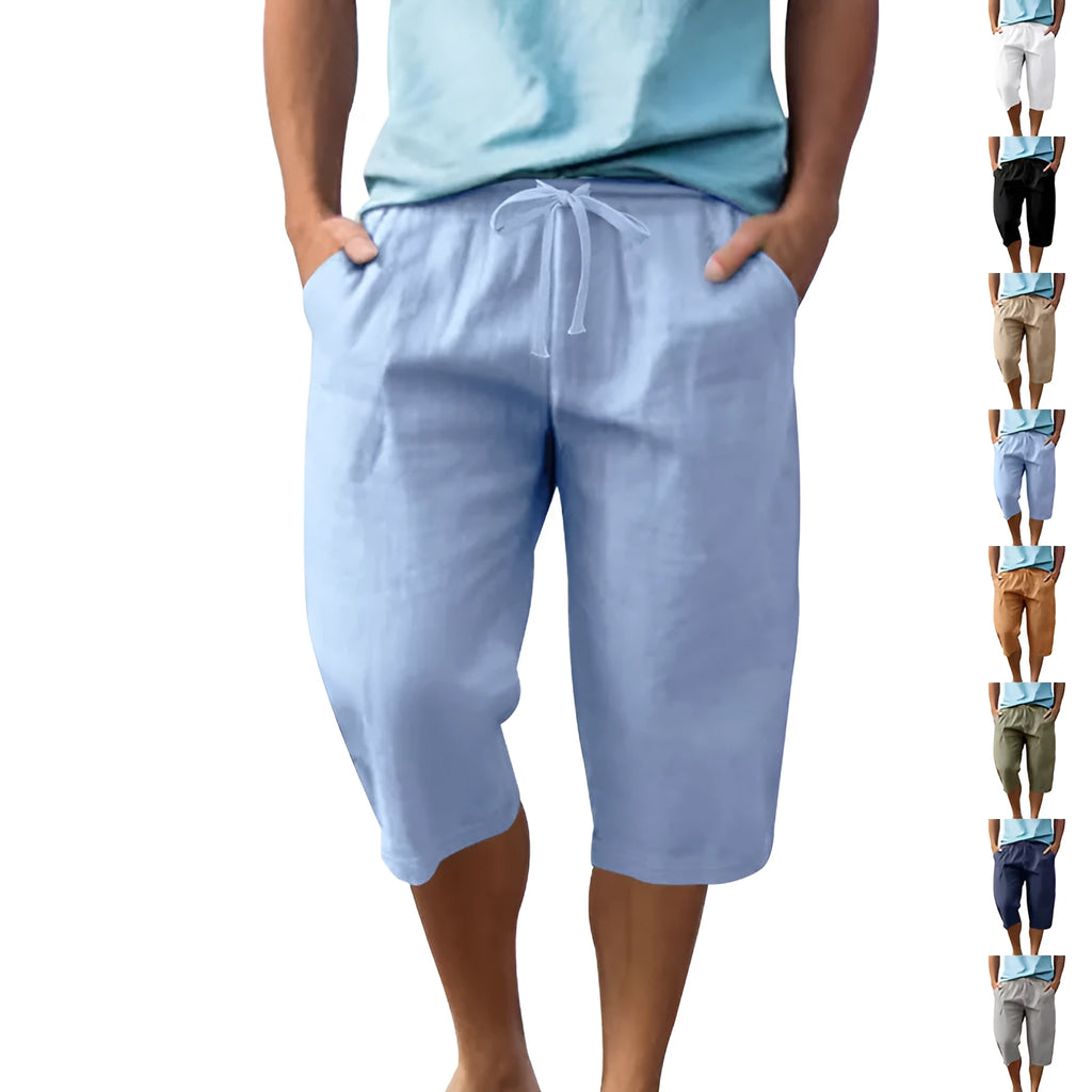 Men's solid colour linen shorts in a loose, cropped style on a drawstring waist.