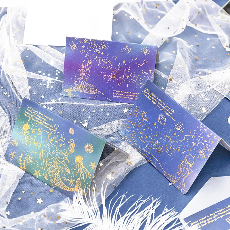 Set of three girly style bronzing mermaid greeting card envelopes on sulfuric acid paper.