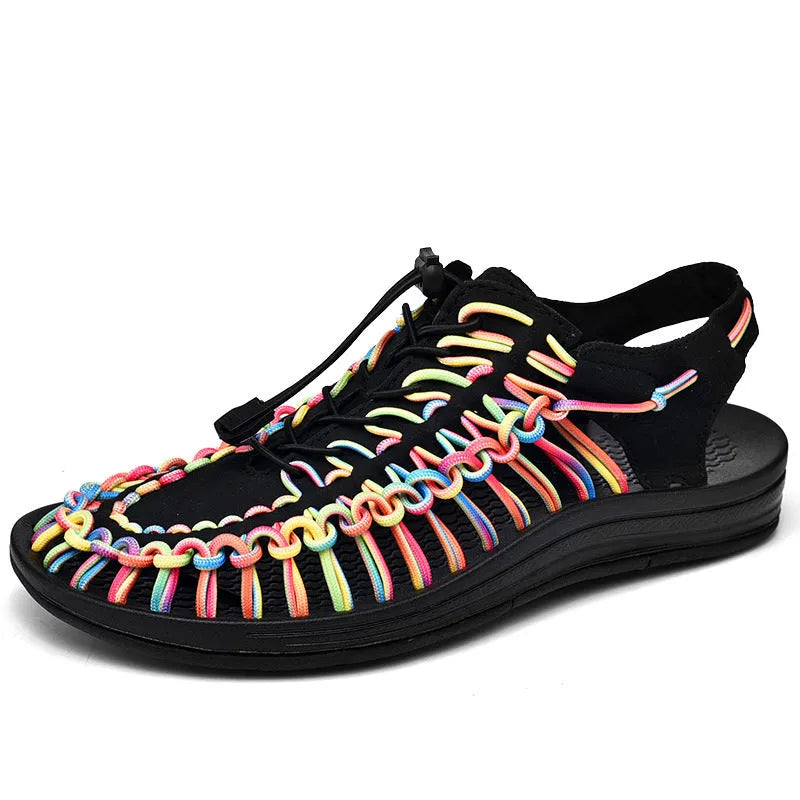 Woven sandals with elastic drawstring tie in rainbow colour, showing rubber sole and net cloth lining