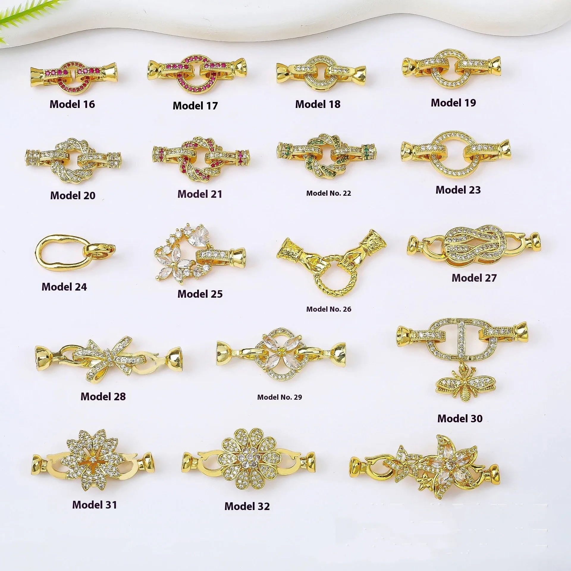 Small gold colour necklace clasp chain buckle on a white background