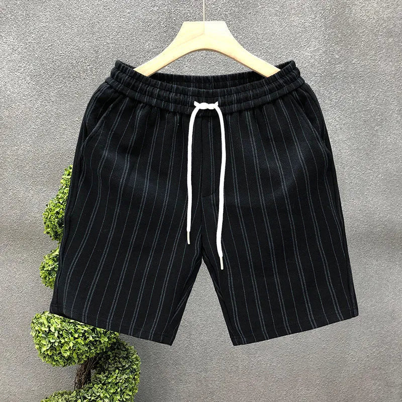 Men's black and white striped casual shorts with fleece lining, double-layer waistband, and ankle banding on straight-leg design
