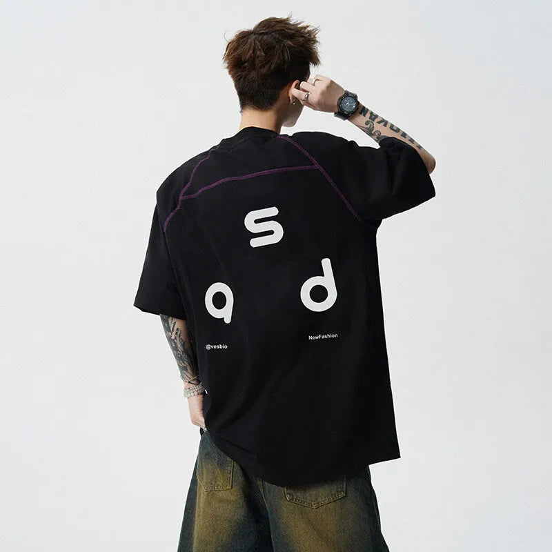 Men's loose fit black cotton T-shirt with a printed letter design on the front.