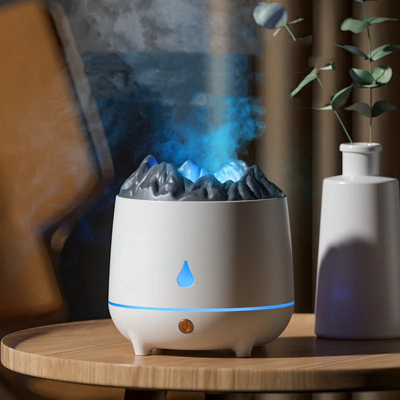 Volcano-shaped humidifier with flaming mountain design in white colour showing mist emission
