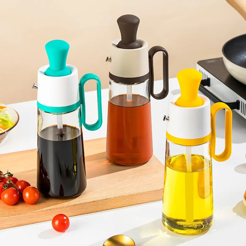 Yellow, green, and brown 550ml glass oil dispenser with silicone brush and stainless steel nozzle.