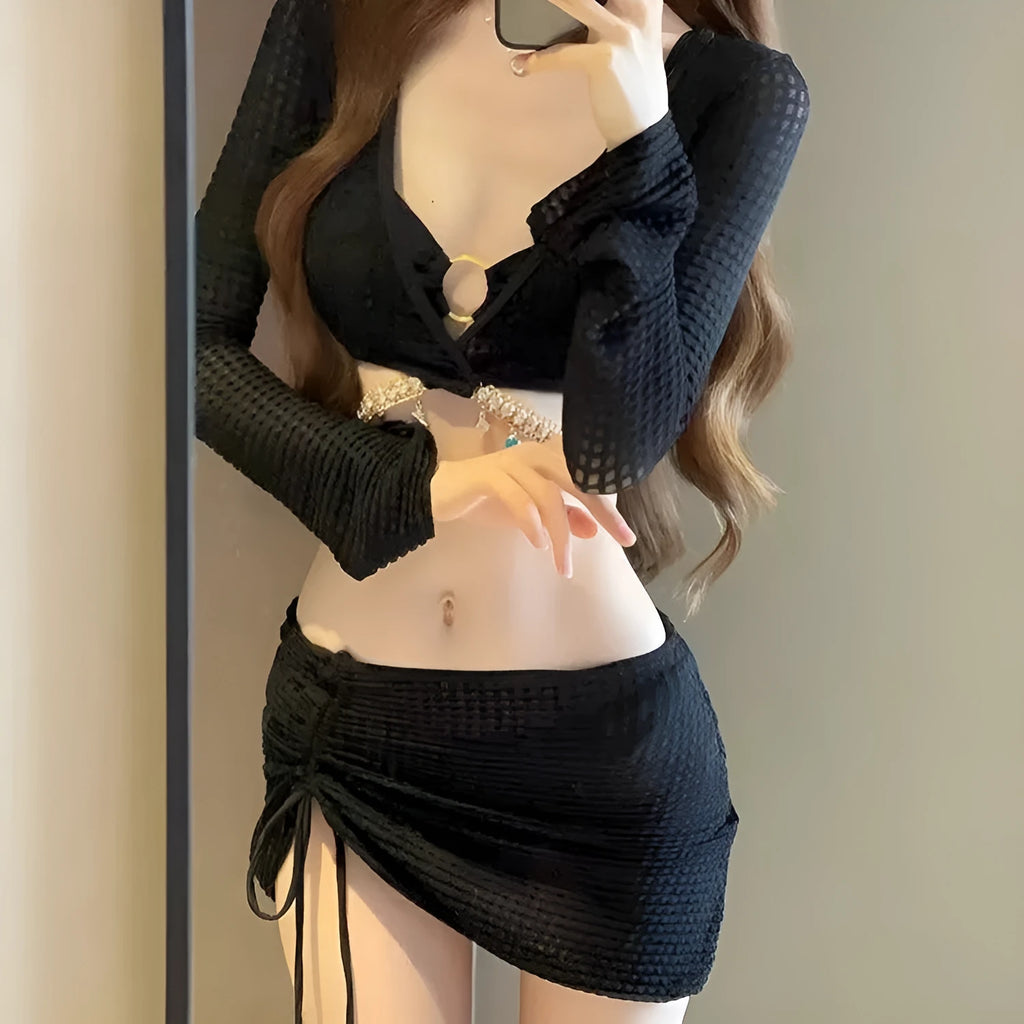 Women's long sleeve black bikini swimsuit with two-piece design for swimming