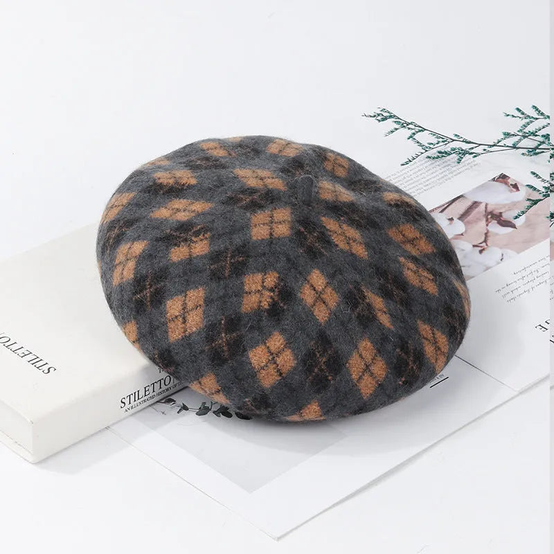 Wool plaid beret with adjustable fit, dome crown, tassel and mesh detail, in blue light coffee plaid.
