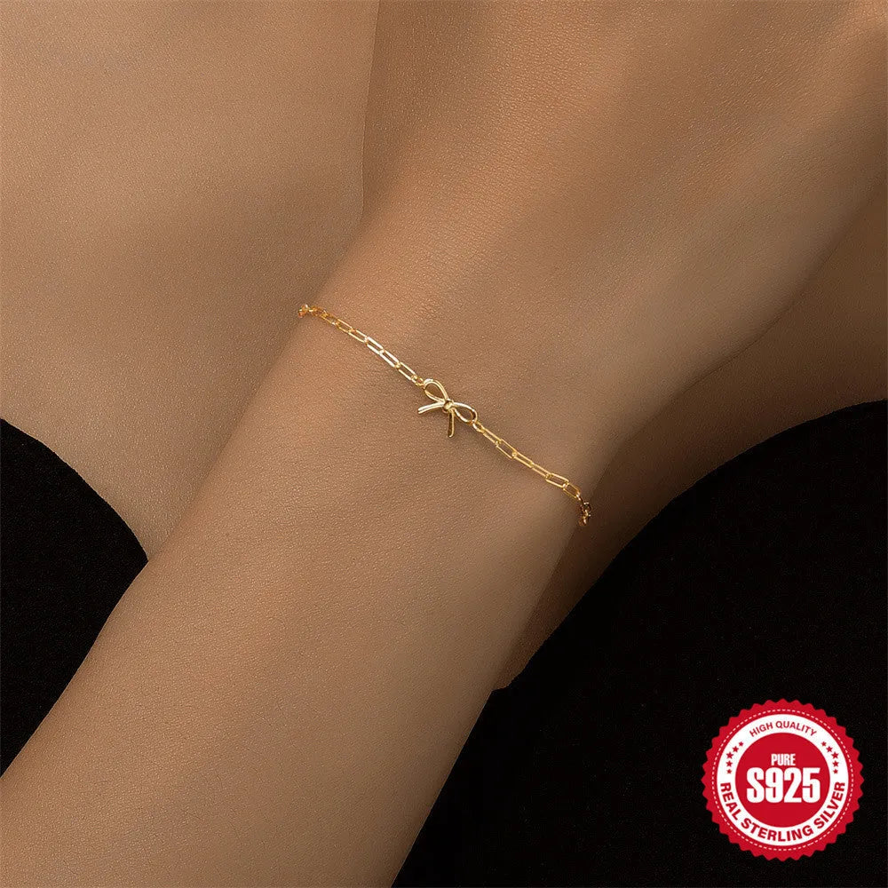 Gold S925 sterling silver women's bracelet with glossy geometric heart and clip chain.