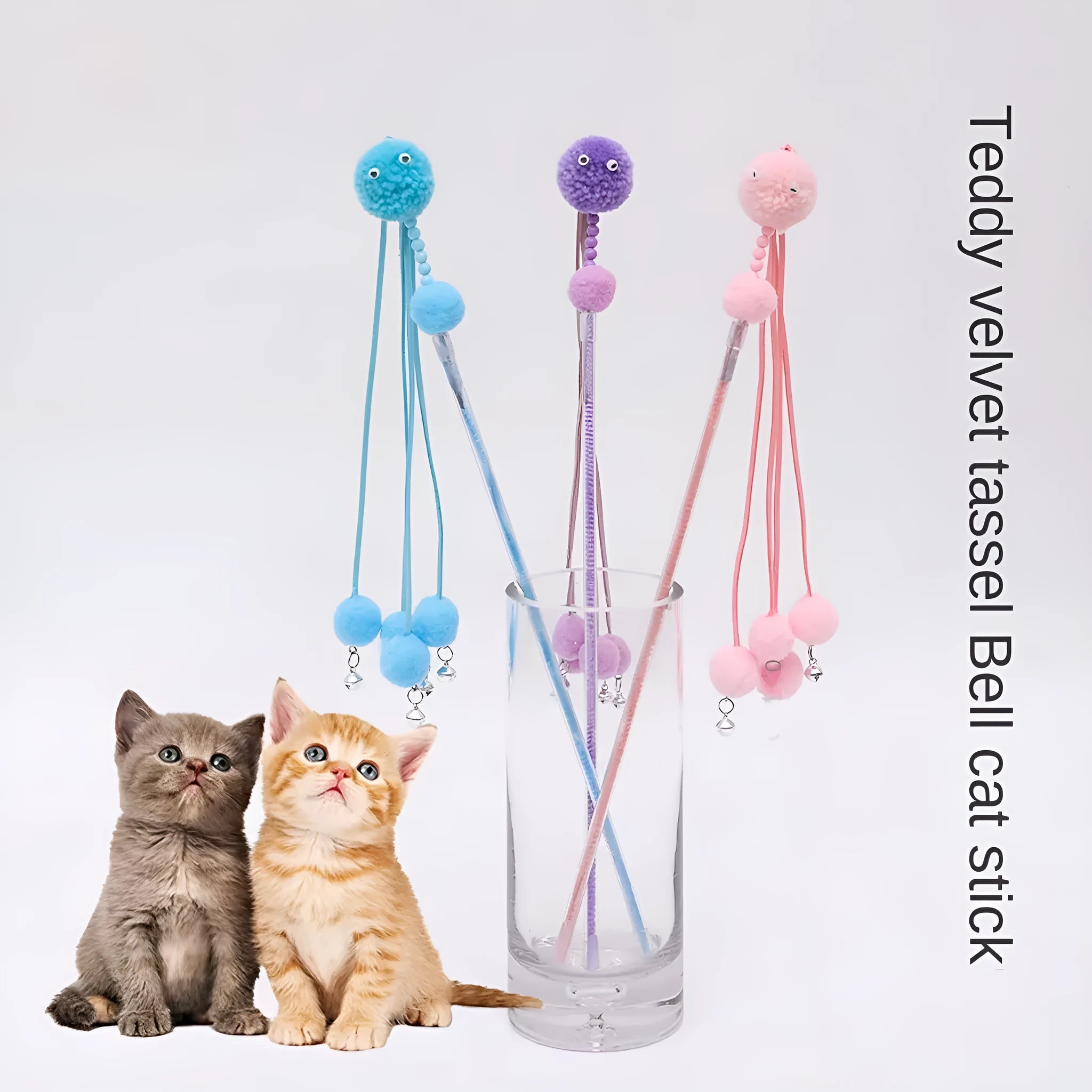 Blue funny cat stick toy with colourful fabric tassels on a plastic wand for interactive play with cats.