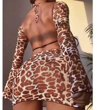 Leopard print women's split bikini swimsuit set with top, skirt, and panties