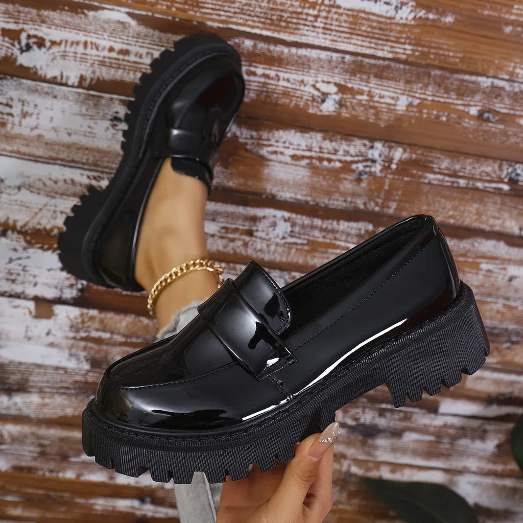 Plus size slip-on loafers with chunky heel in black, green, and wine red colours on a solid background
