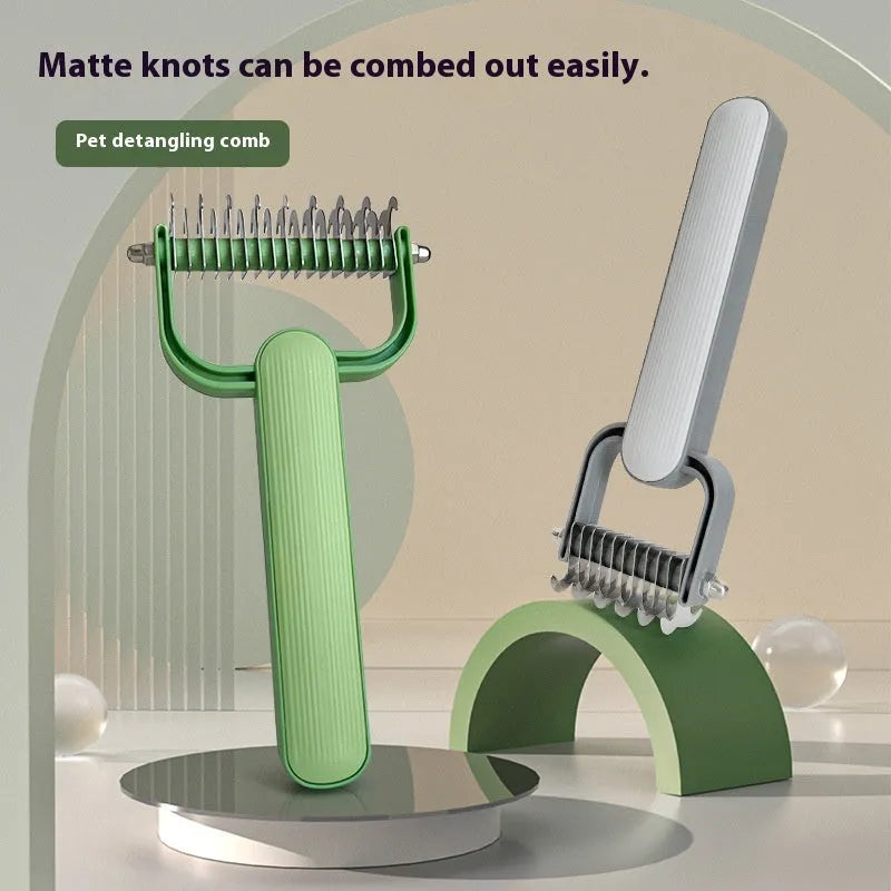 Green and grey dog unknotting combs in small and large sizes with stainless steel teeth on a PP handle.