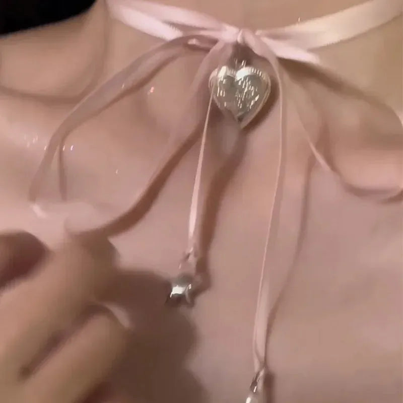 Women's ribbon love pendant fashion necklace in electroplated alloy, available in 33 colours on clavicle-length chain