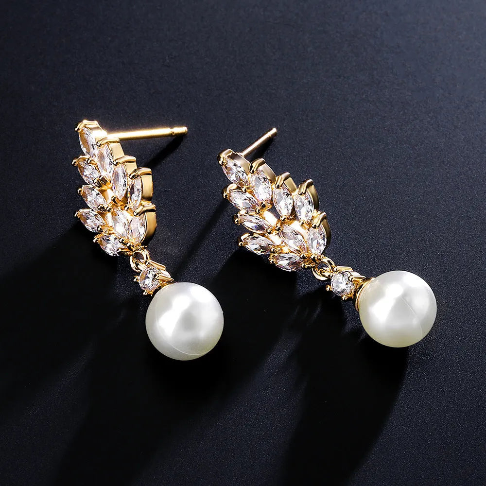 Geometric flower earrings with micro inlaid zircon stones on copper base, plated in gold, platinum, or rose gold.