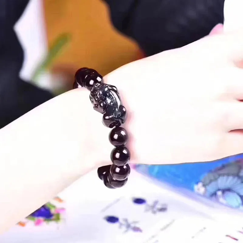 Natural ice colour eye obsidian crystal bracelet with measured beads on wrist