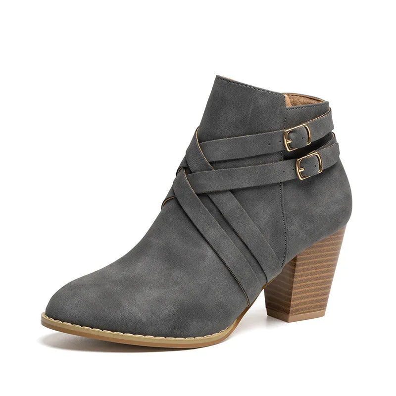 Short boots with 7cm heels in black, brown, or grey colours, showing side zipper and rubber sole
