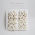 Children's dovetail bow hairclips in cloth, showing colour options like beige brown grid dots and blue flowers.