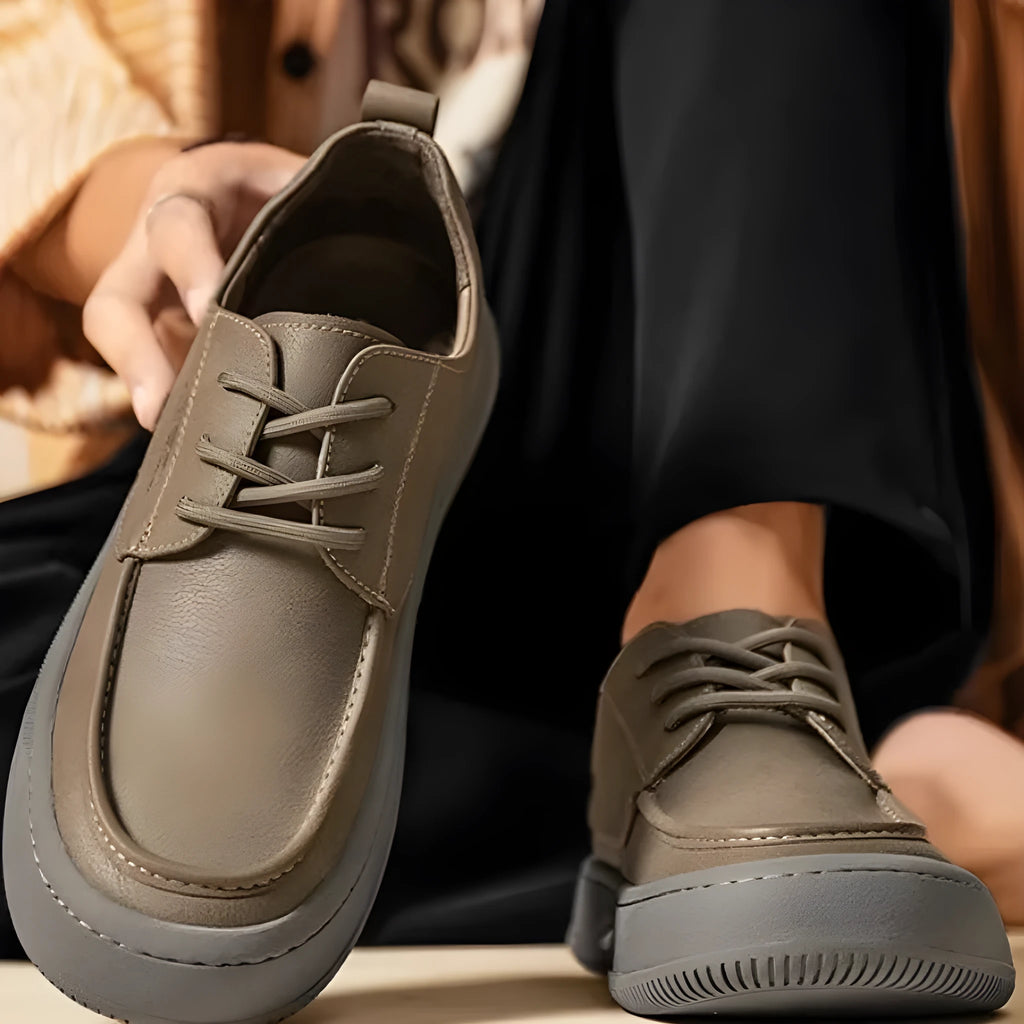 Brown retro leather casual shoes with big toe design and visible stitching on a rubber sole.
